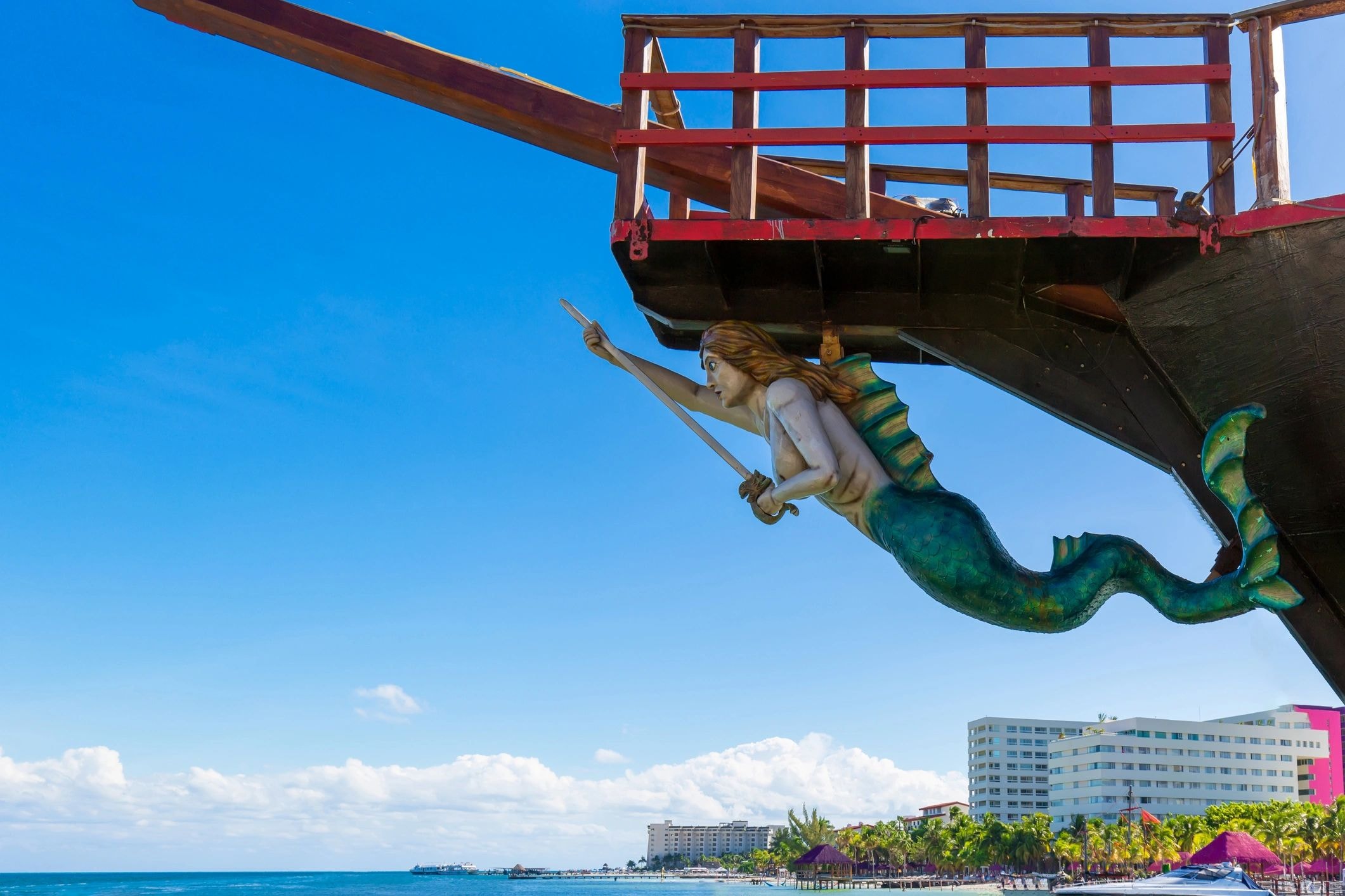 Mermaid figurehead on boat hull at the seaside