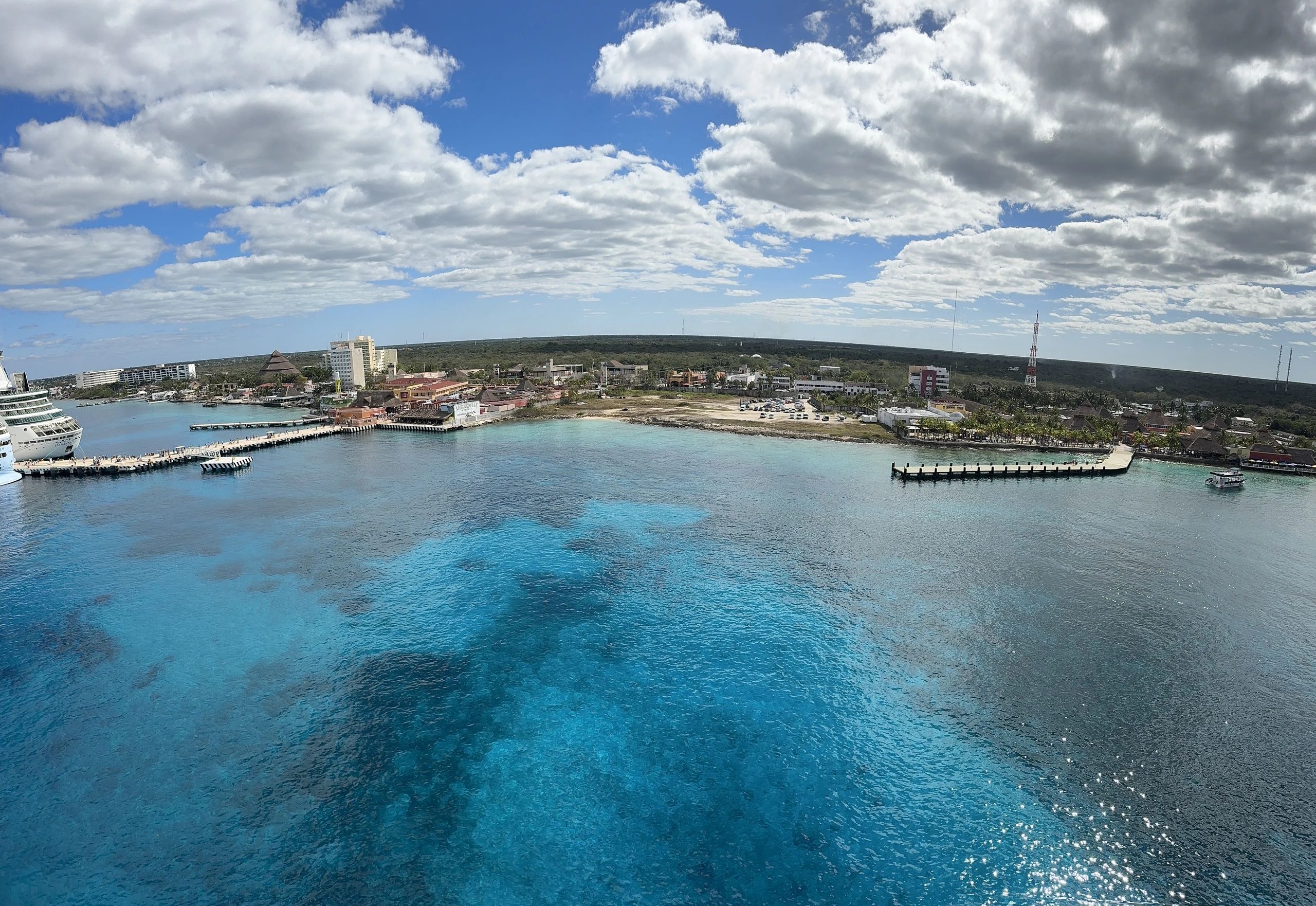 Tropical island aerial view with cruise ship and turquoise water
