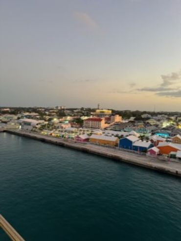 Caribbean harbor at dusk with colorful waterfront buildings