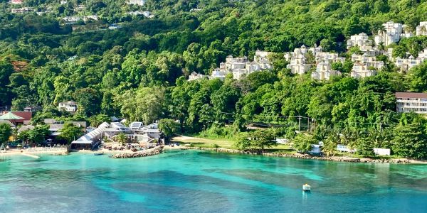 Tropical beach resort with colorful waterfront buildings